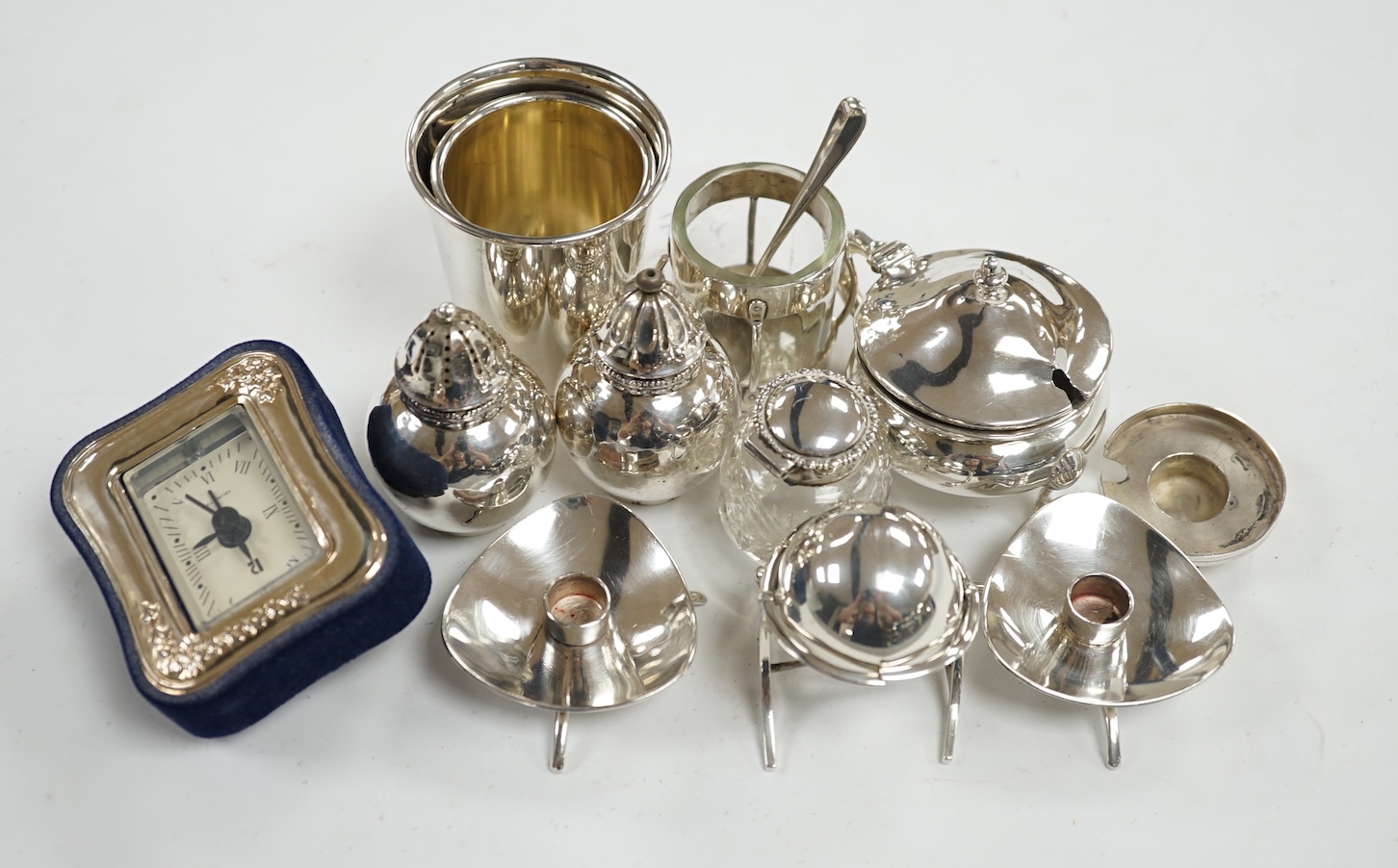 Small silver including an Edwardian miniature silver revolving 'breakfast dish' by Saunders & Shepherd, Birmingham, 1909, height 50mm, four condiments including one modelled as a ship's lamp and two Danish white metal, a